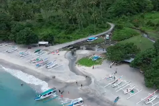 Aerial view of a Lombok beach with a sandbar and moored boats